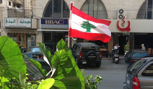 Lebanese flag hoisted near the site of one of Tripoli's explosions