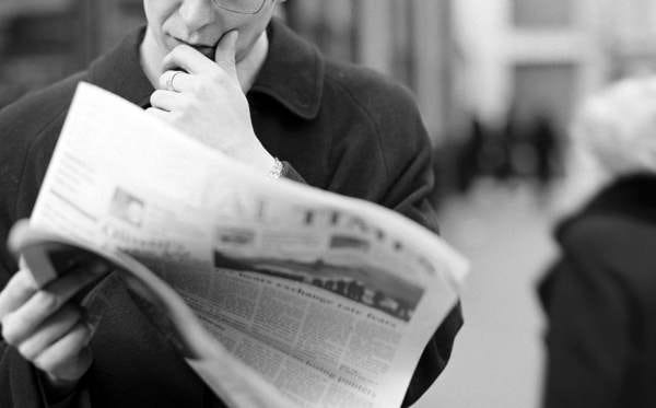 Reading newspaper